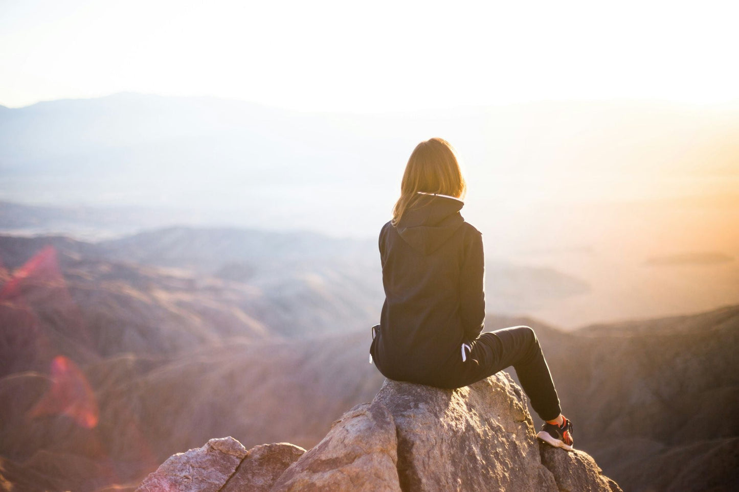 Outdoor enthusiast selecting a natural, unscented deodorant stick, staying true to her minimalistic approach to skincare even while active.